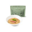 Bowl of oatmeal with apples and mint leaves, accompanied by a green 'Food Force' package on a white background.